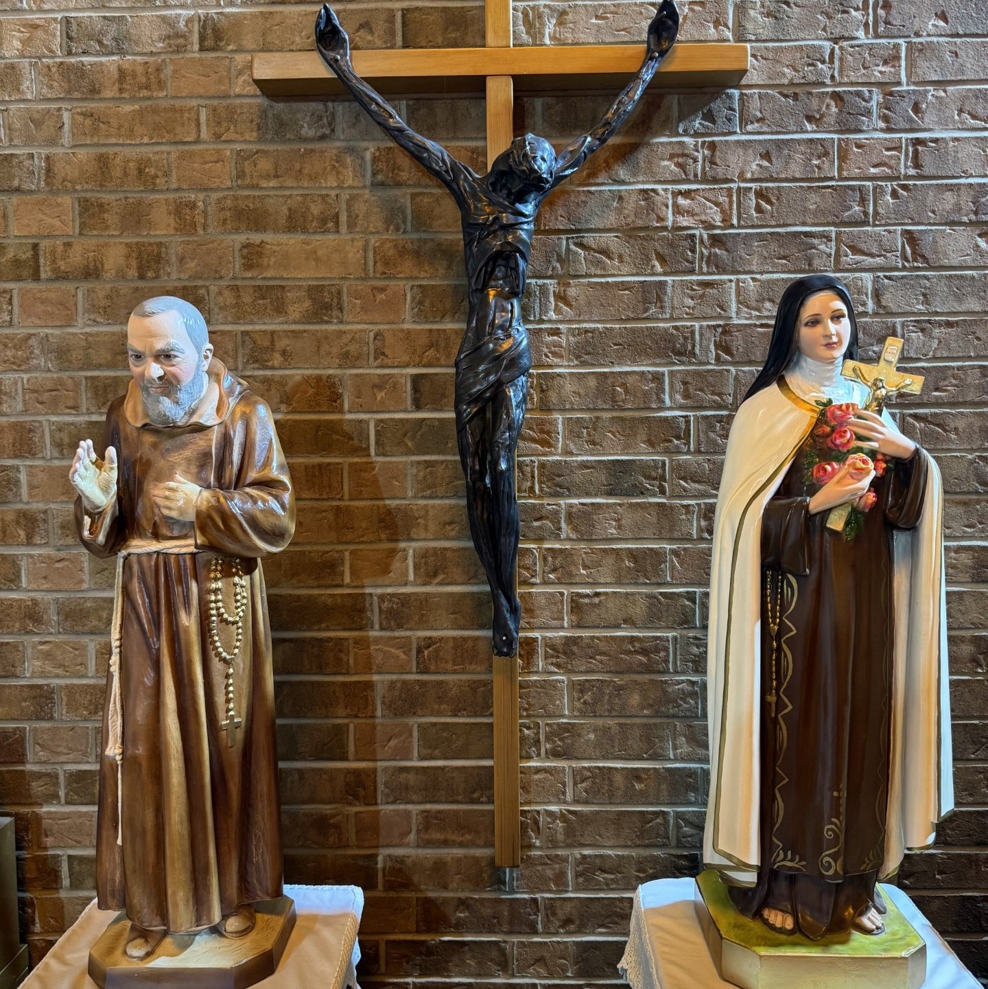 Statues of St. Theresa and Padre Pio